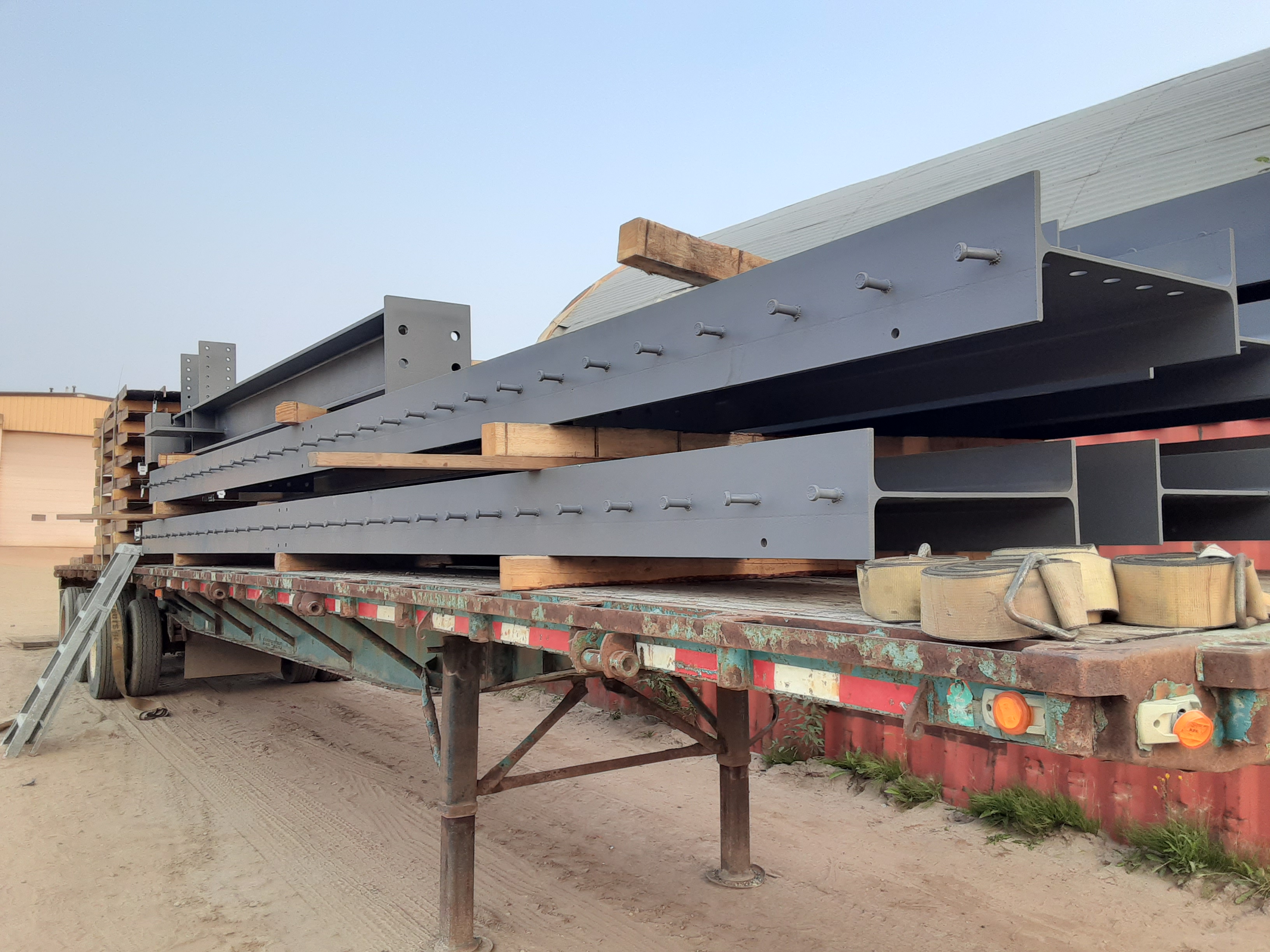 A load of painted structural loaded on a trailer.